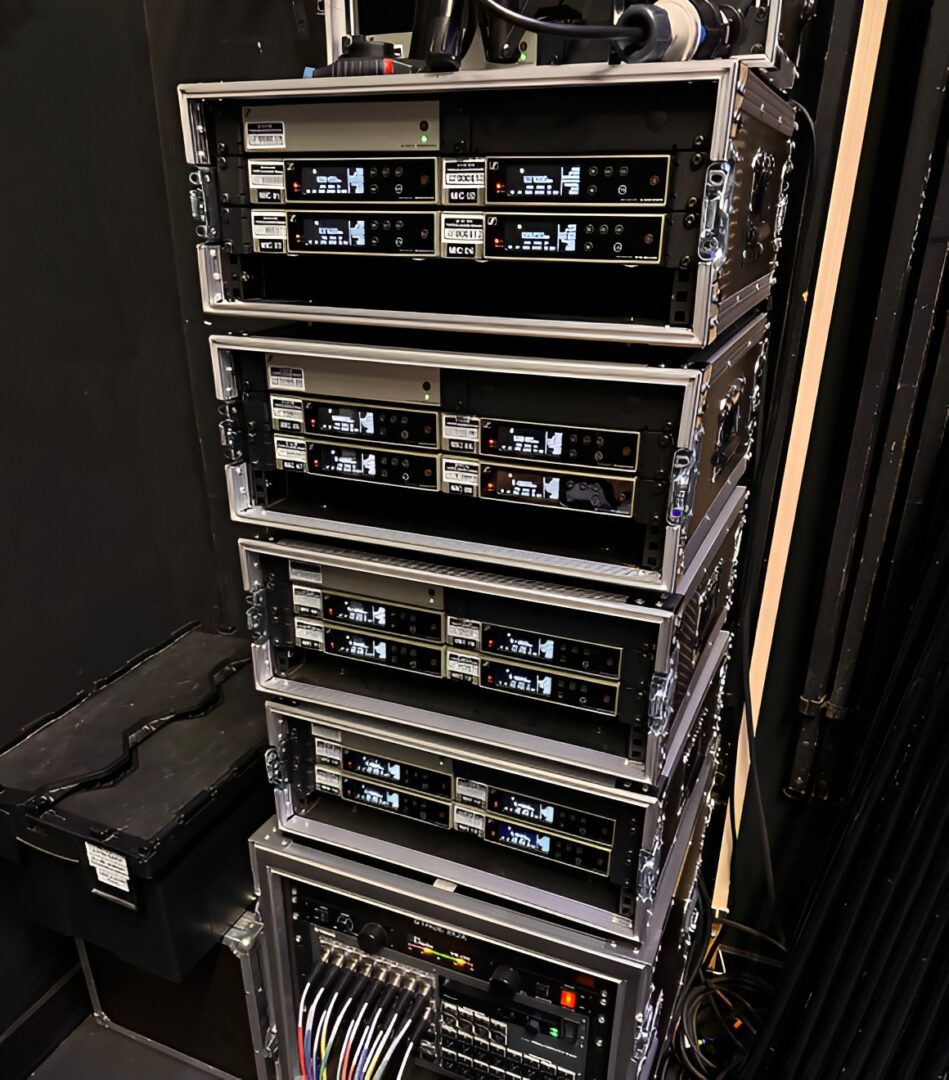 Stack of audio-visual equipment in rack.